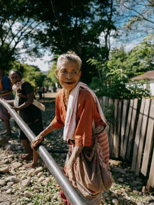 Community member carrying water